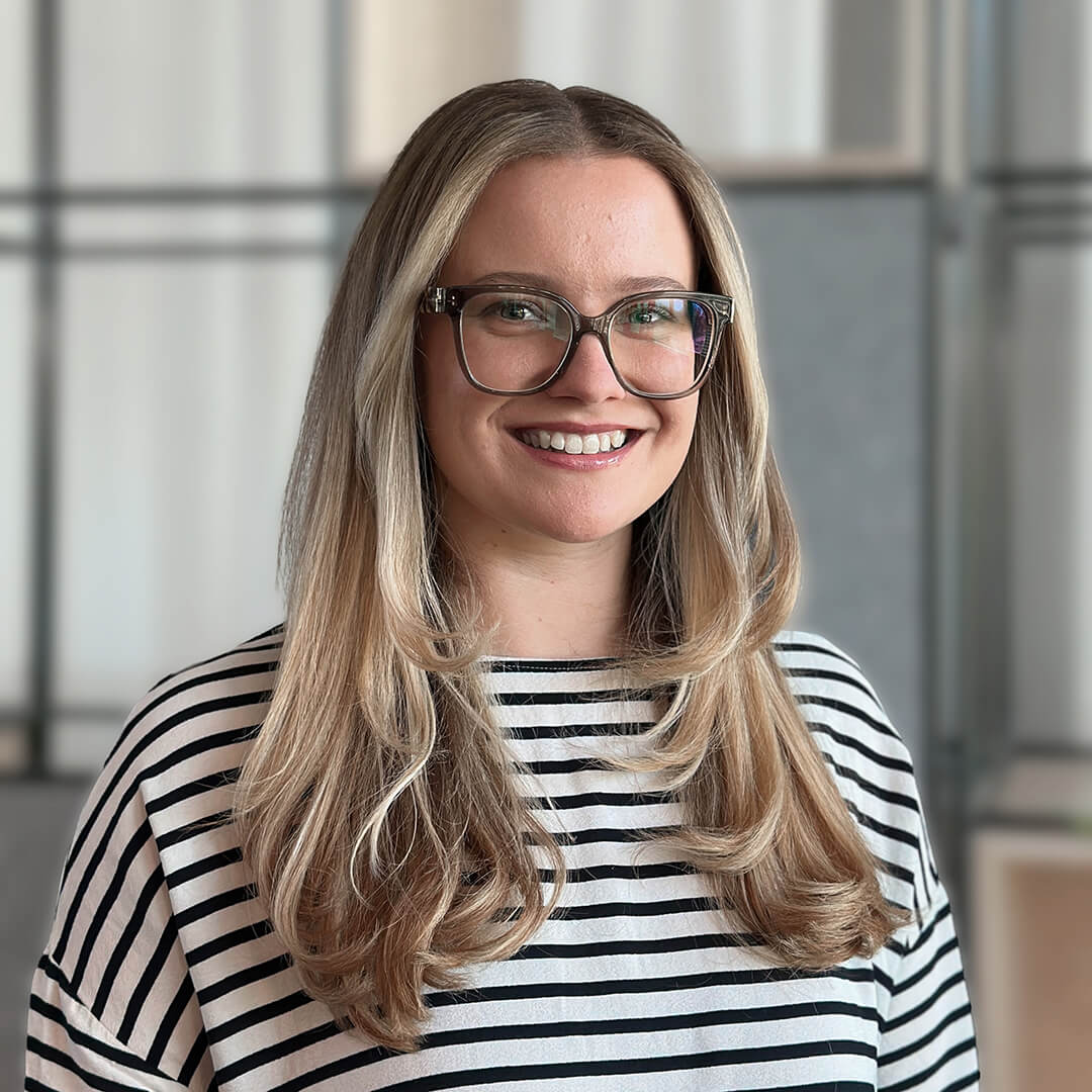 Nastja, Junior Talent Acquisition Manager on the United Internet recruiting team, smiling in the office